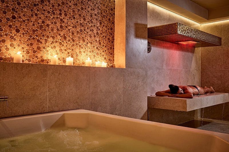 Indoor jacuzzi and chromatherapy rain shower in the wet area at Zoe Spa Mykonos